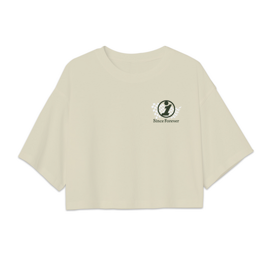 Cream-colored crop top with a small logo featuring a checkered pattern, the number one, and the text "Since Forever" on the front.