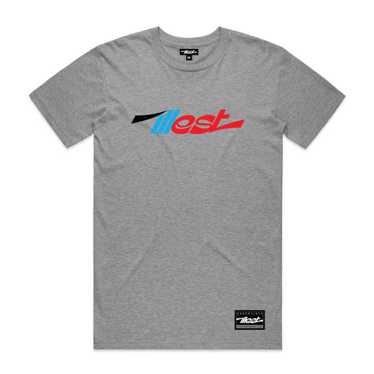 Gray Illest Essentials Tee with a bold, colorful logo design across the chest and a black and white brand label at the bottom.