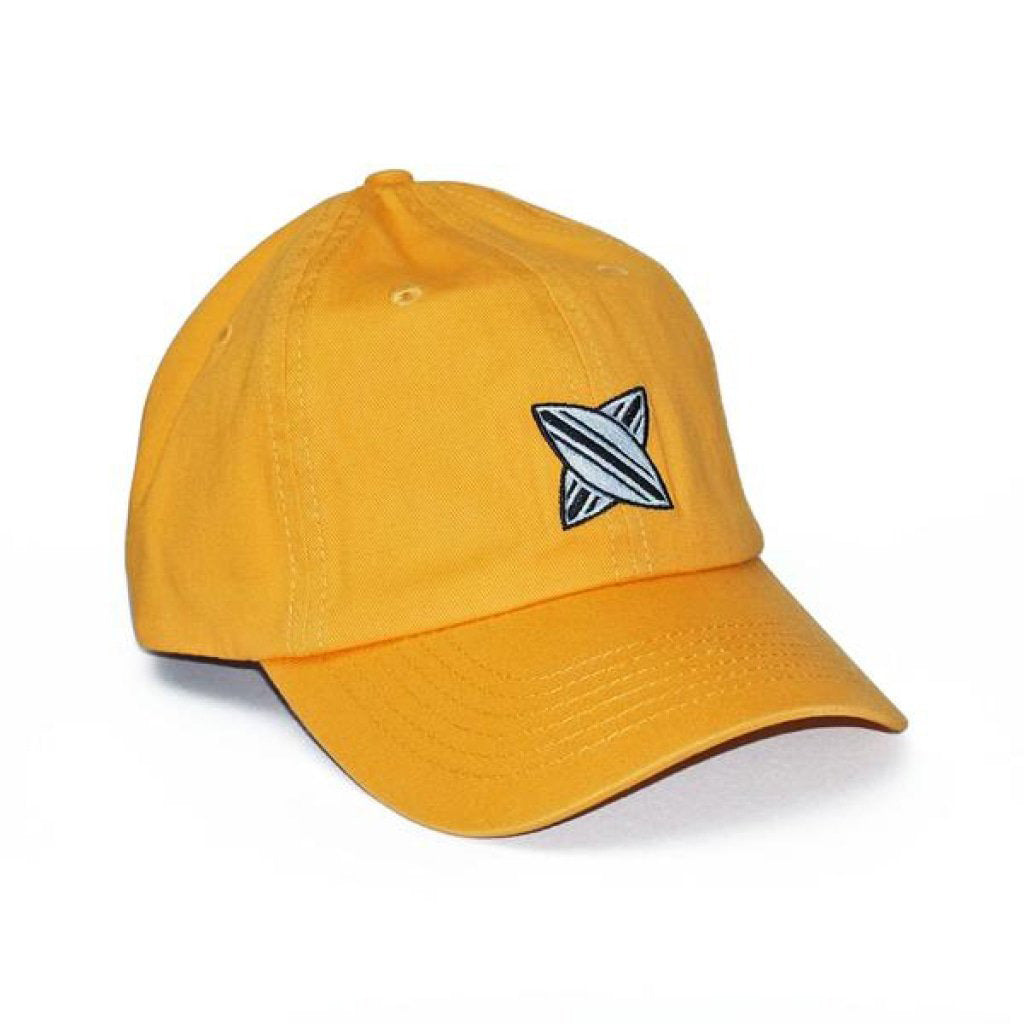 Yellow dad cap with a black and white embroidered geometric star design on the front panel.