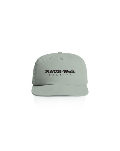 Light gray dad cap with "RAUH-Welt BEGRIFF" embroidered in black on the front, featuring a curved brim and adjustable strap.