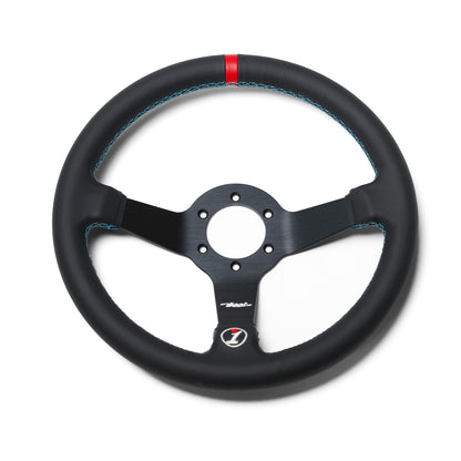 Black leather steering wheel with blue stitching and a red mark at the top, designed for racing or high-performance vehicles.