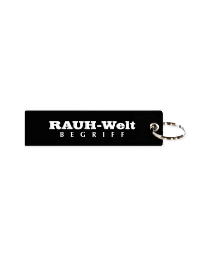Illest Rough-World Flight Tag Keychain with black rectangular tag and silver keyring, featuring bold white text design.