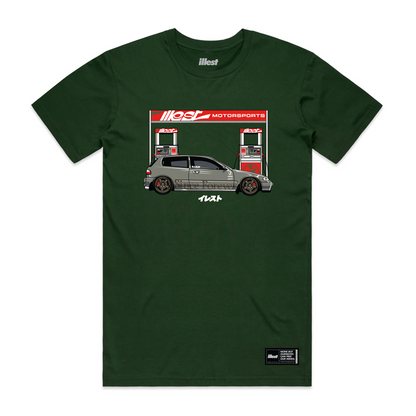 Green Illest Filling Station T-shirt featuring a graphic of a car at a gas station with Illest branding and Japanese characters.