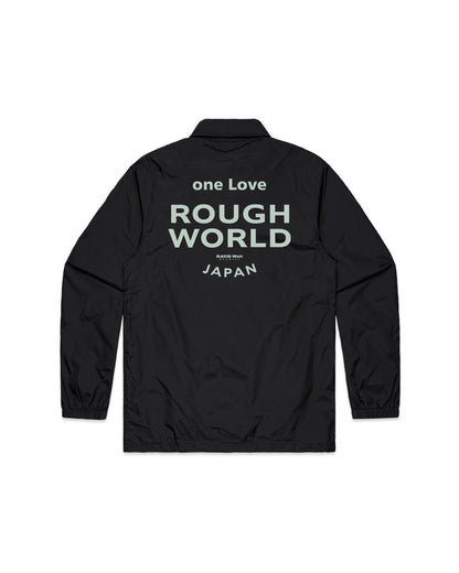 Black coach jacket with bold "Rough World" and "Japan" text on the back, featuring a relaxed fit and lightweight design.