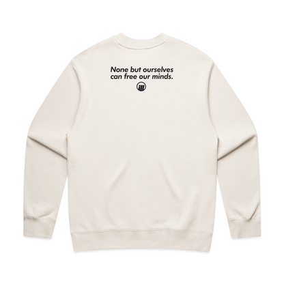 Cream-colored crewneck sweatshirt featuring a bold black logo and the phrase "None but ourselves can free our minds" printed on the back.