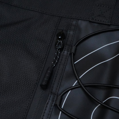 Close-up of a black travel tote bag featuring a zipper pocket, textured fabric, and a sleek design with white line accents.