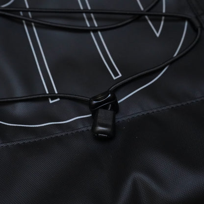 Close-up of a black Illest Travel Tote Bag with a drawstring closure, featuring white line accents on durable, water-resistant material.