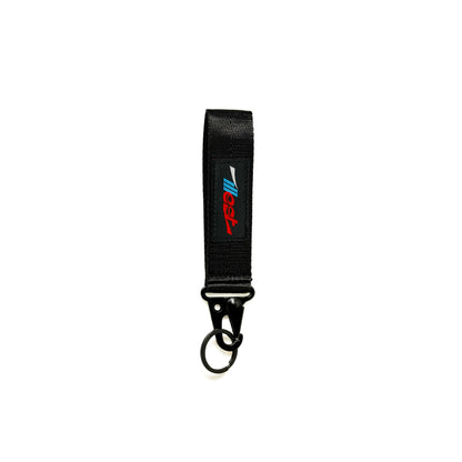 Illest Essential Fabric Keychain with black strap, metal clasp, and colorful logo patch, designed for durability and style.