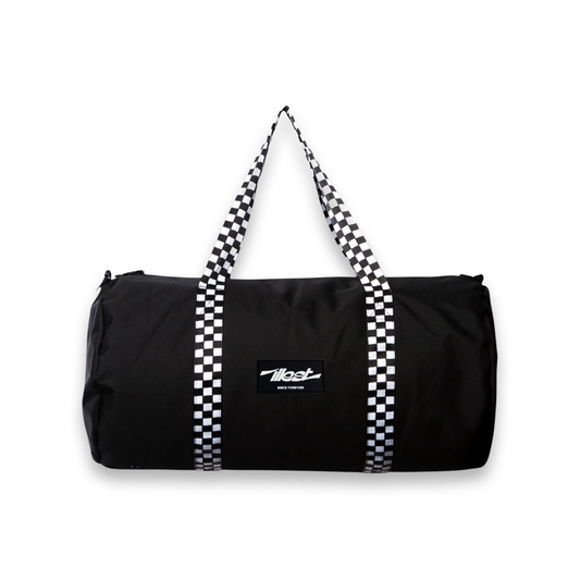 Black duffle bag with checkered straps and a logo patch, designed for travel or gym use.