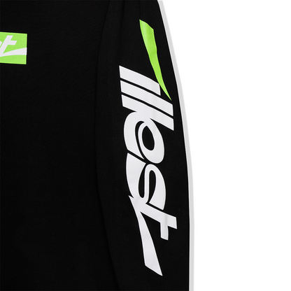 Black collegiate long-sleeve tee featuring bold white and green logo graphics on the sleeve and chest.