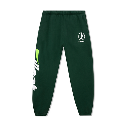Green collegiate sweatpants with logo and bold graphic print on one leg, featuring an elastic waistband and cuffed ankles.