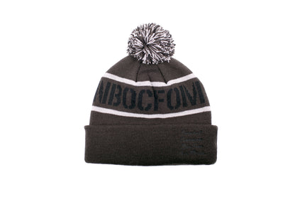 ILLEST ACRONYM BEANIE in dark gray with white stripes, embroidered logo, and a pom-pom on top, designed for warmth and style.